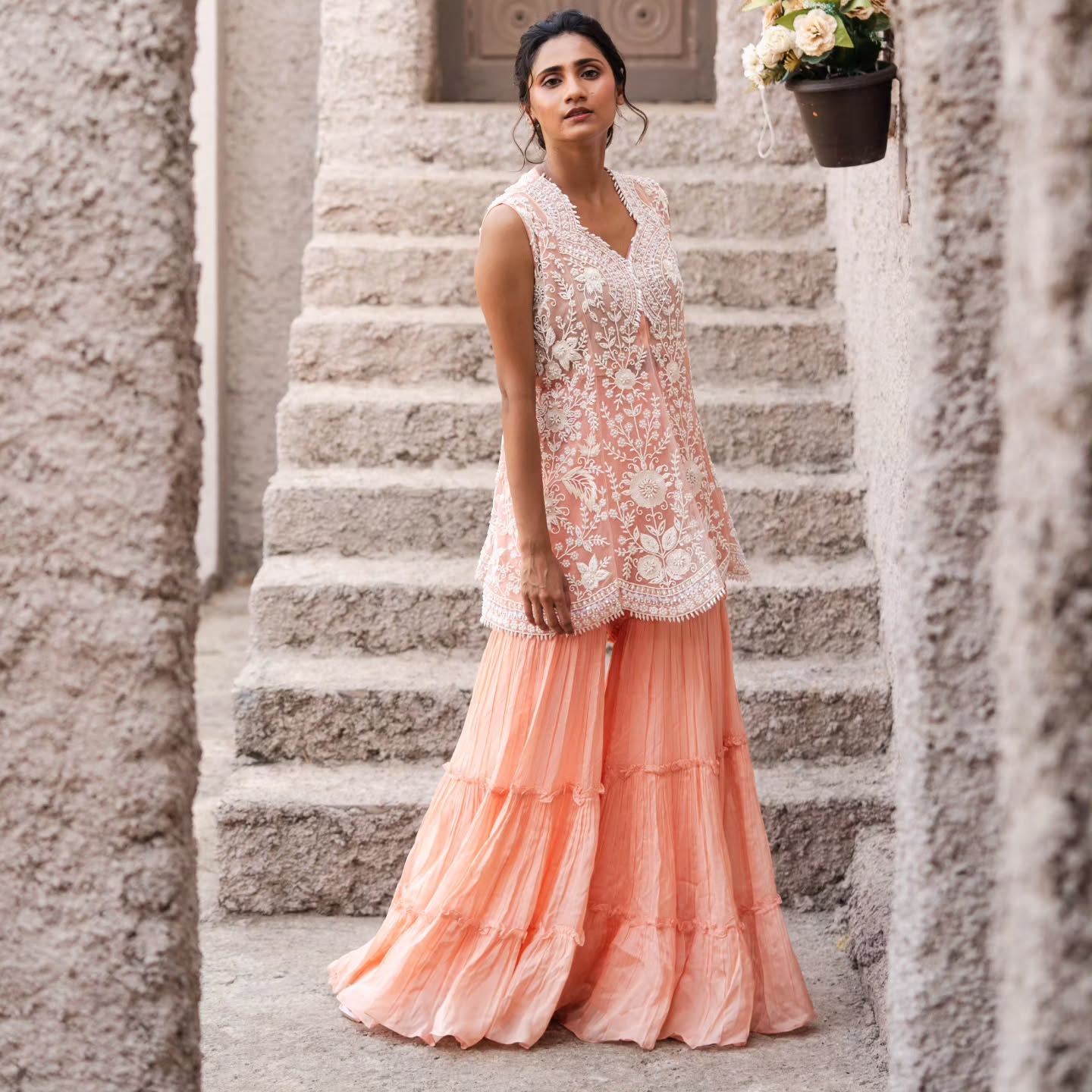 Peach taiwan net peplum top with flat chiffon lehenga pallazo