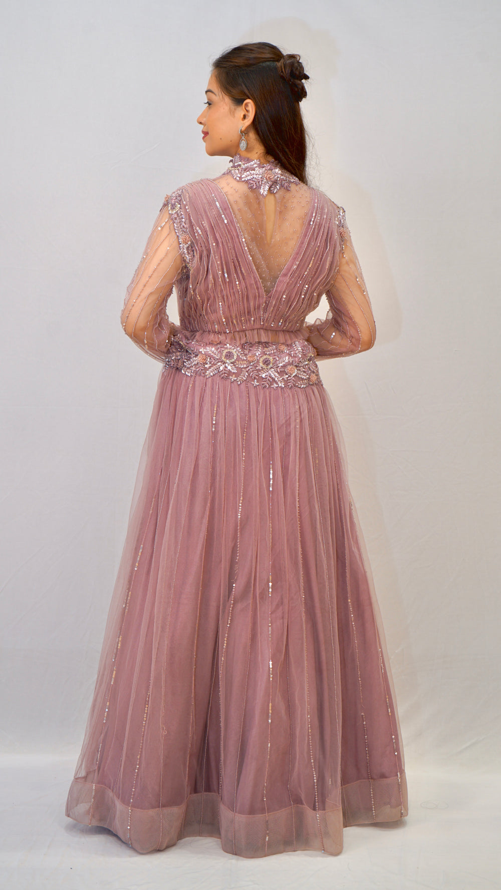 Purple turtle neck blouse with heavy net lehenga