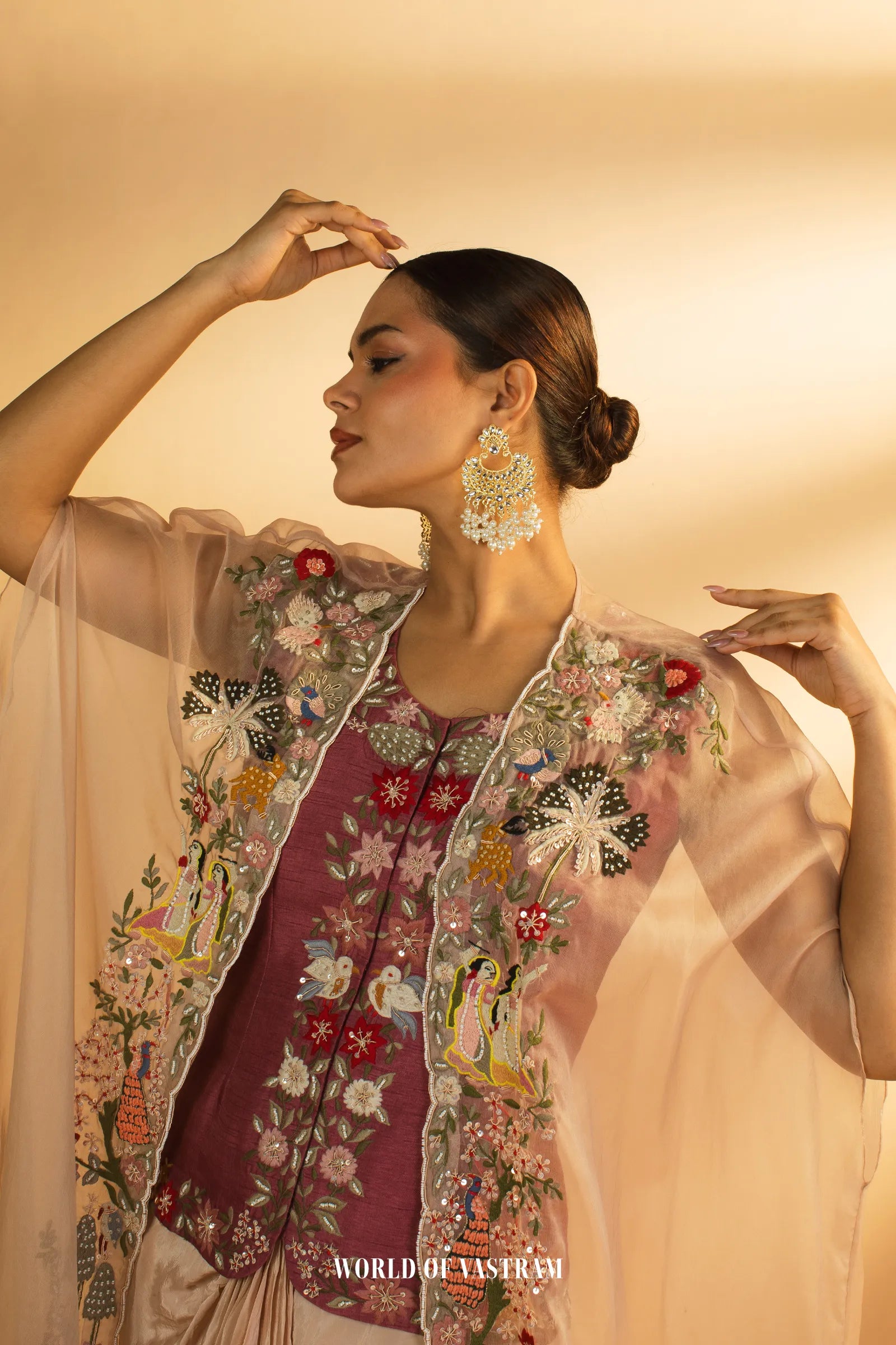 Embroidered Drape with Statement Cape