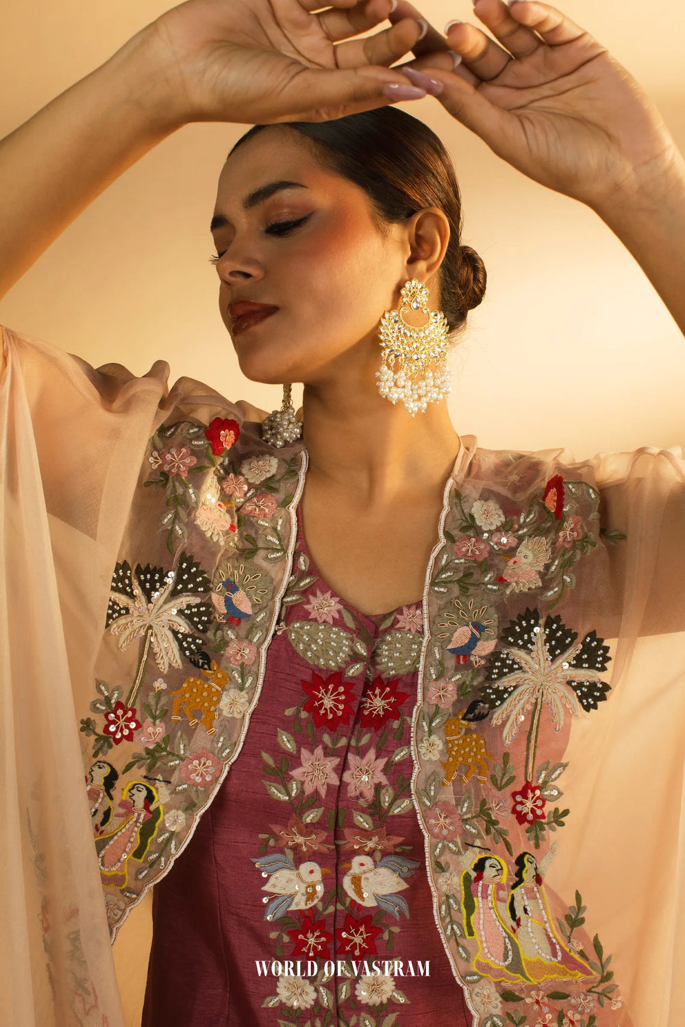 Embroidered Drape with Statement Cape