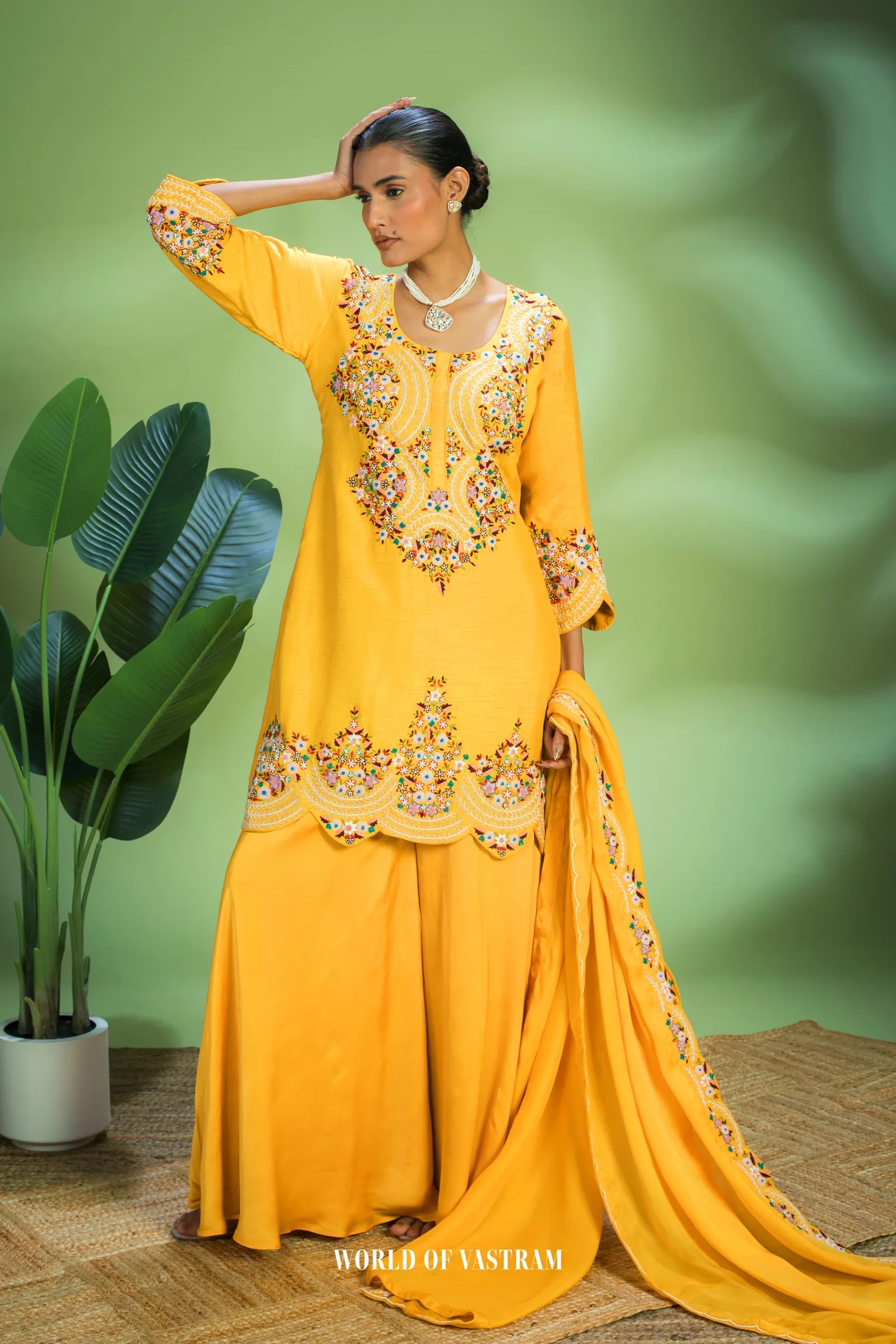 Yellow dupien silk peplum top with satin organza lehenga pallazo