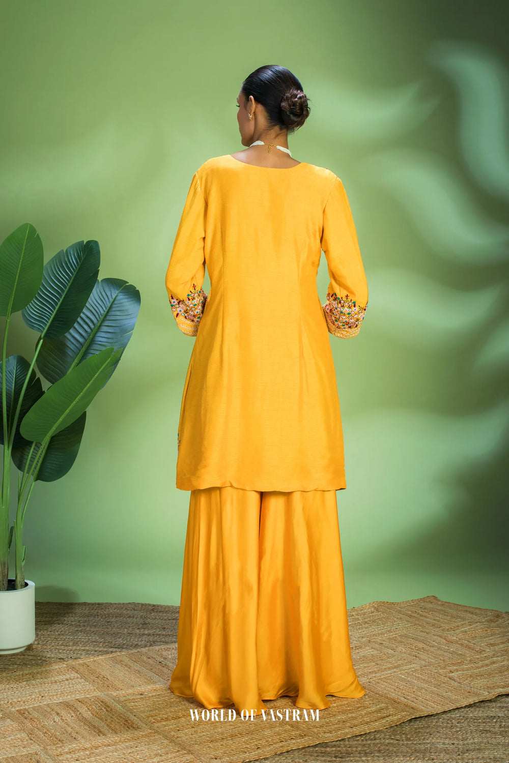 Yellow dupien silk peplum top with satin organza lehenga pallazo
